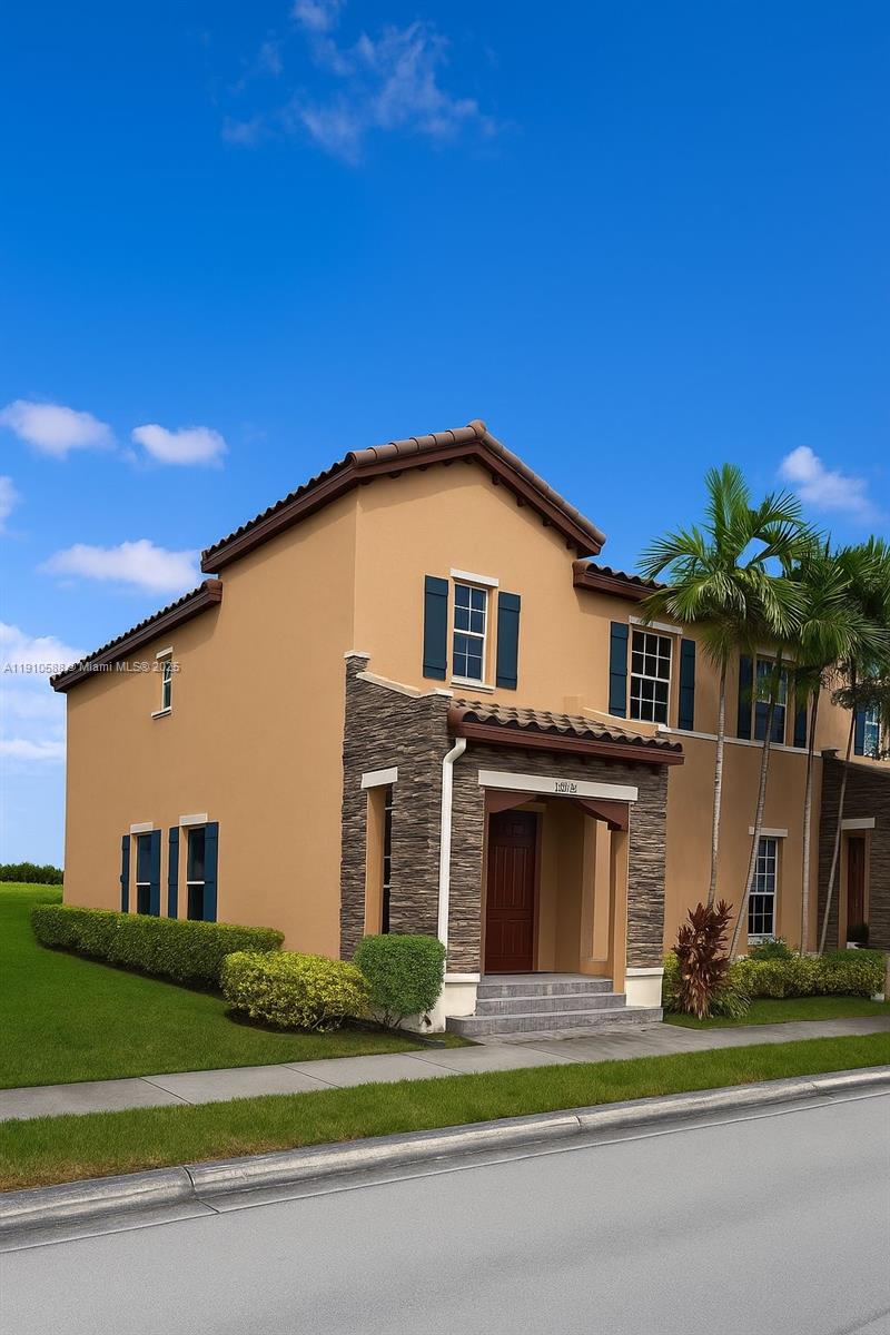 a front view of a house with a yard