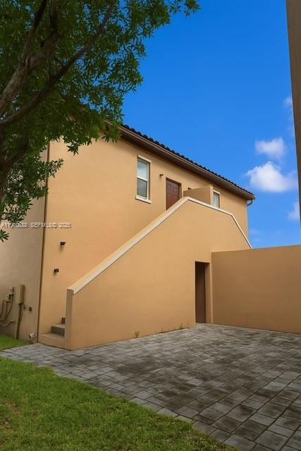 17025 Southwest 96th Street Miami, FL 33196 - Photo 3 of 3 a backyard of a house with lots of green space