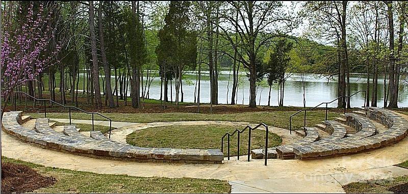 10601 Wildlife Road Charlotte, NC 28278 - Photo 19 of 31 a view of a swimming pool with a patio