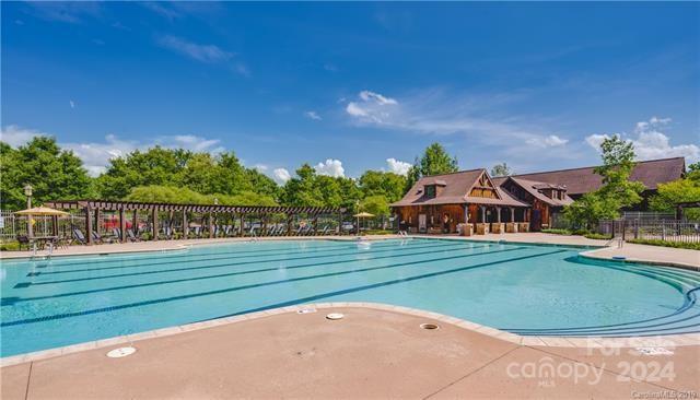 10601 Wildlife Road Charlotte, NC 28278 - Photo 7 of 31 a view of a house with a swimming pool