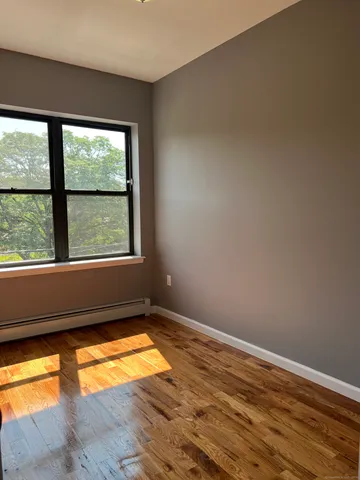a view of an empty room with a window