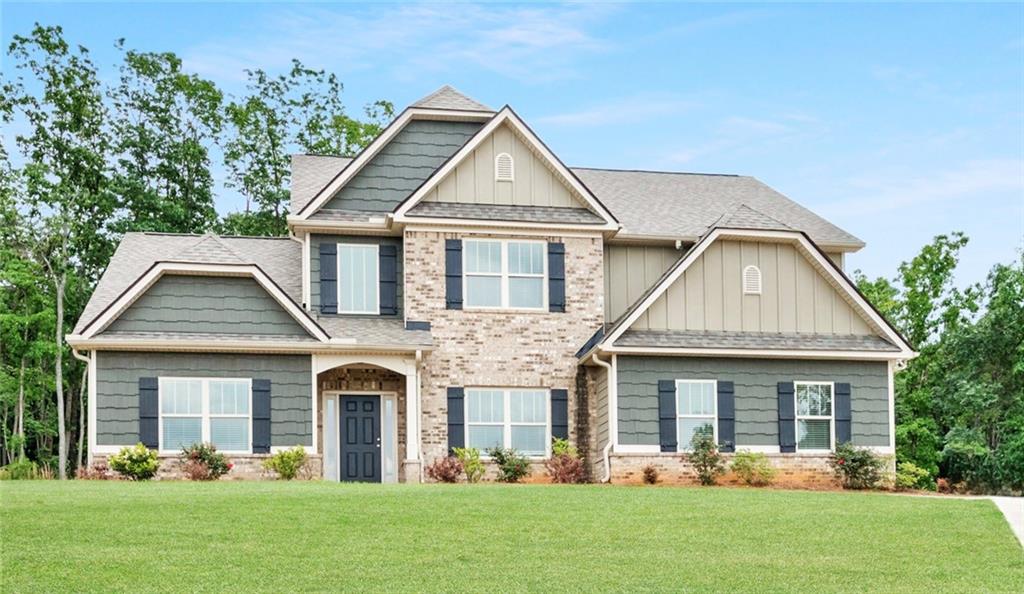 13 Jake Court Northeast Rydal, GA 30171 - Photo 1 of 1 a front view of a house with a yard and trees