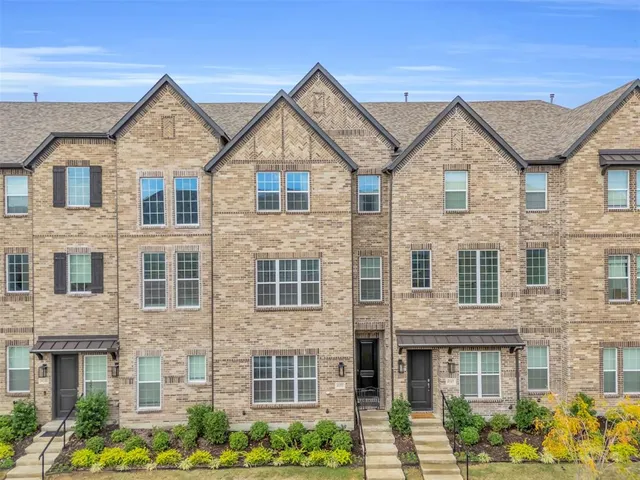 a front view of a house with glass windows