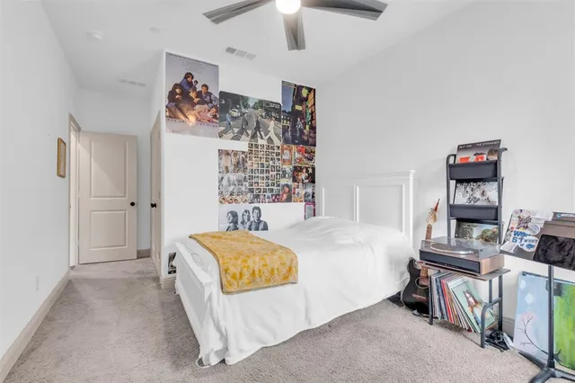 a bedroom with a bed and a tv