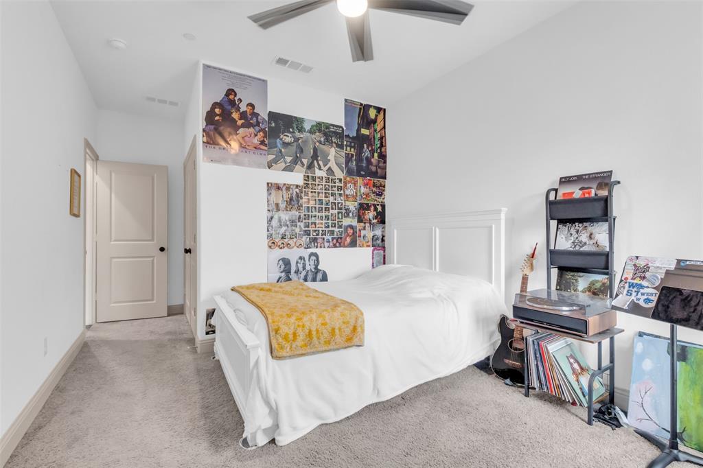 4153 Shavano Drive Frisco, TX 75034 - Photo 29 of 35 a bedroom with a bed and a tv