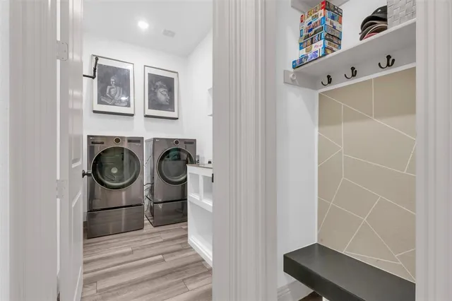 a view of storage and utility room with washer and dryer