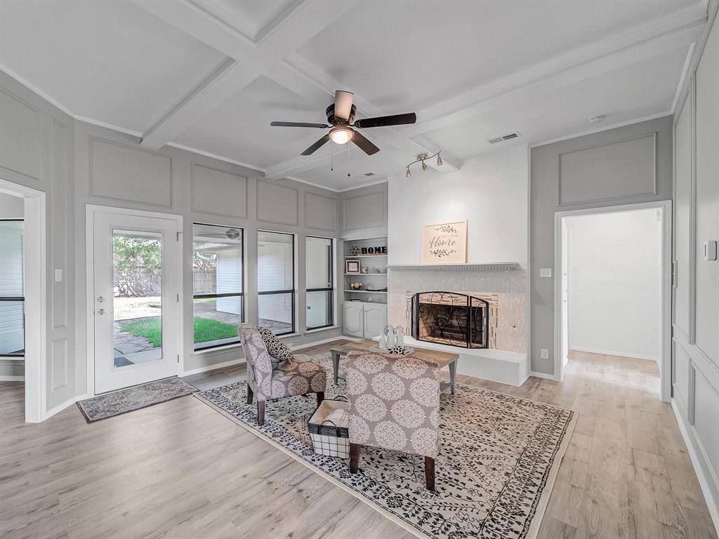 3105 Regency Carrollton, TX 75007 - Photo 2 of 18 a living room with furniture and a fireplace