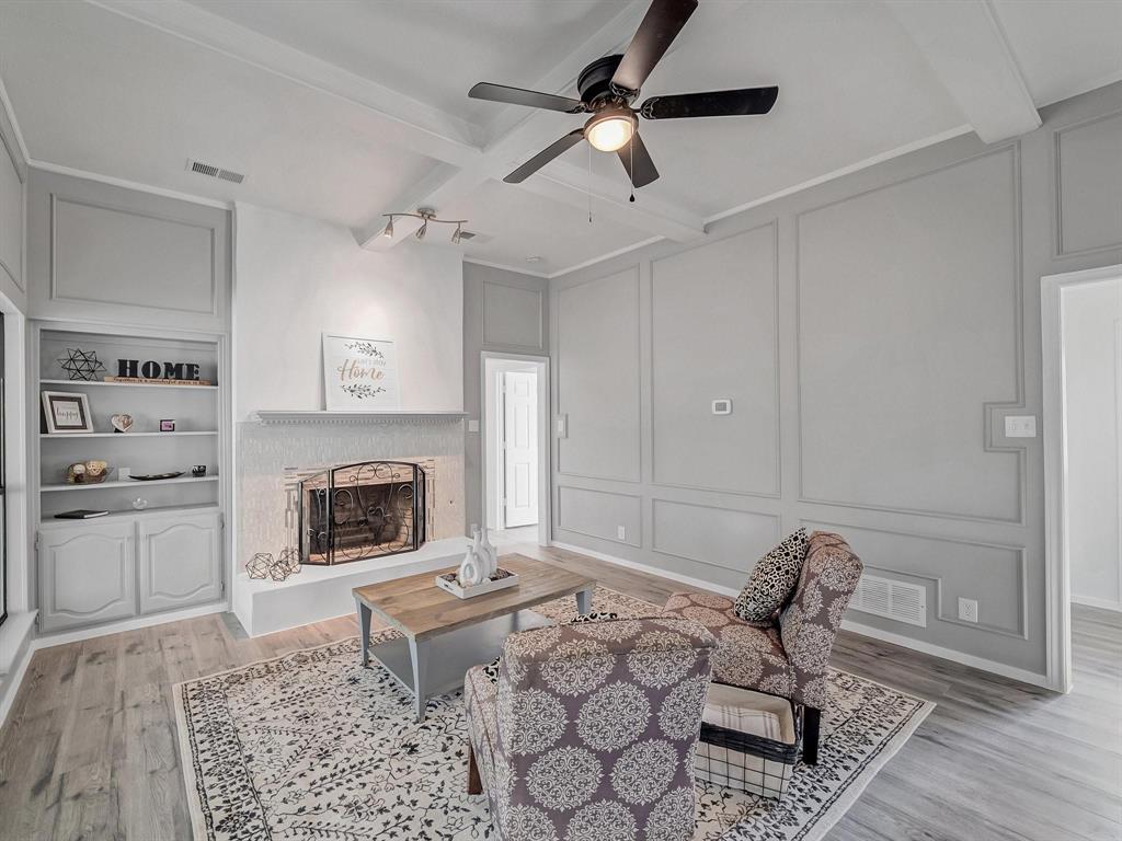 3105 Regency Carrollton, TX 75007 - Photo 4 of 18 a living room with furniture and a fireplace