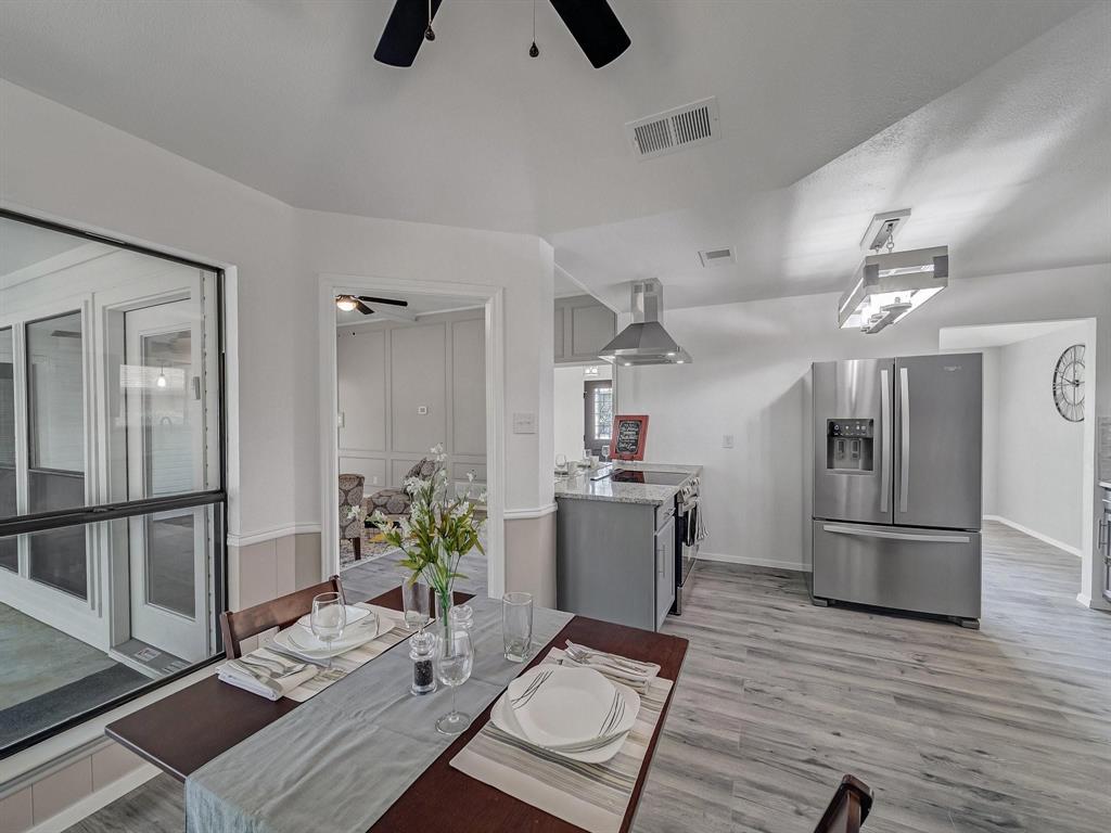 3105 Regency Carrollton, TX 75007 - Photo 7 of 18 a living room with furniture and kitchen view