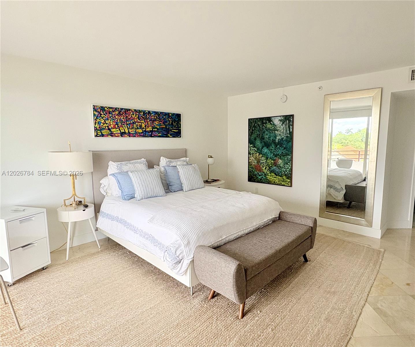 151 Southeast 15th Road, Unit 601 Miami, FL 33129 - Photo 19 of 36 a spacious bedroom with a bed and window