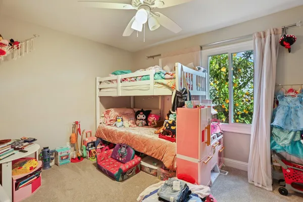a bedroom with furniture and a chandelier