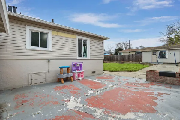 a backyard of a house with seating space
