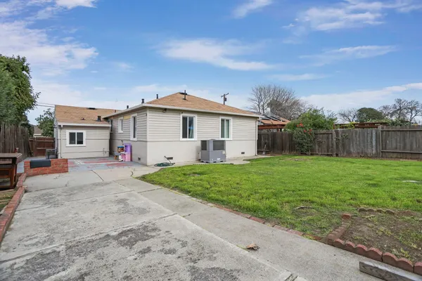 a view of a house with yard and a garden