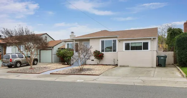 a front view of a house with a outdoor space