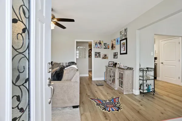 a view of living room with furniture and flat screen tv