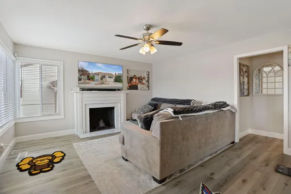 a living room with furniture and a fireplace