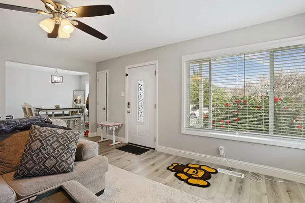 a bedroom with furniture and a window