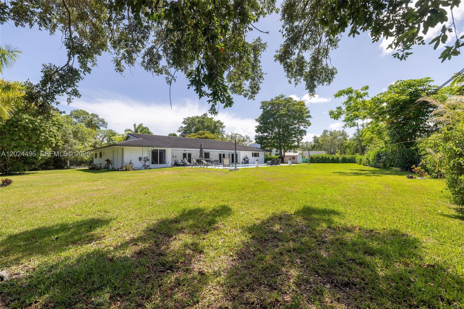 6875 North Cartee Road Palmetto Bay, FL 33158 - Photo 39 of 42 a view of outdoor space yard and swimming pool
