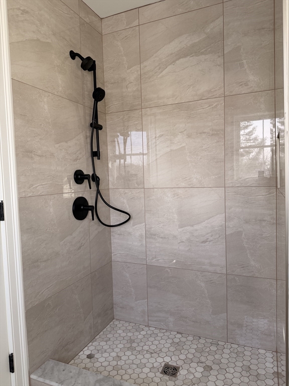 9 Acton Road, Unit 10 Chelmsford, MA 01824 - Photo 9 of 15 a bathroom with a shower