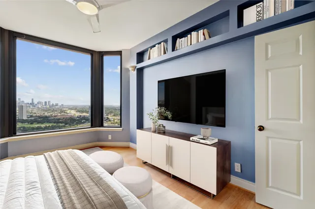 a bathroom with a granite countertop sink and shower