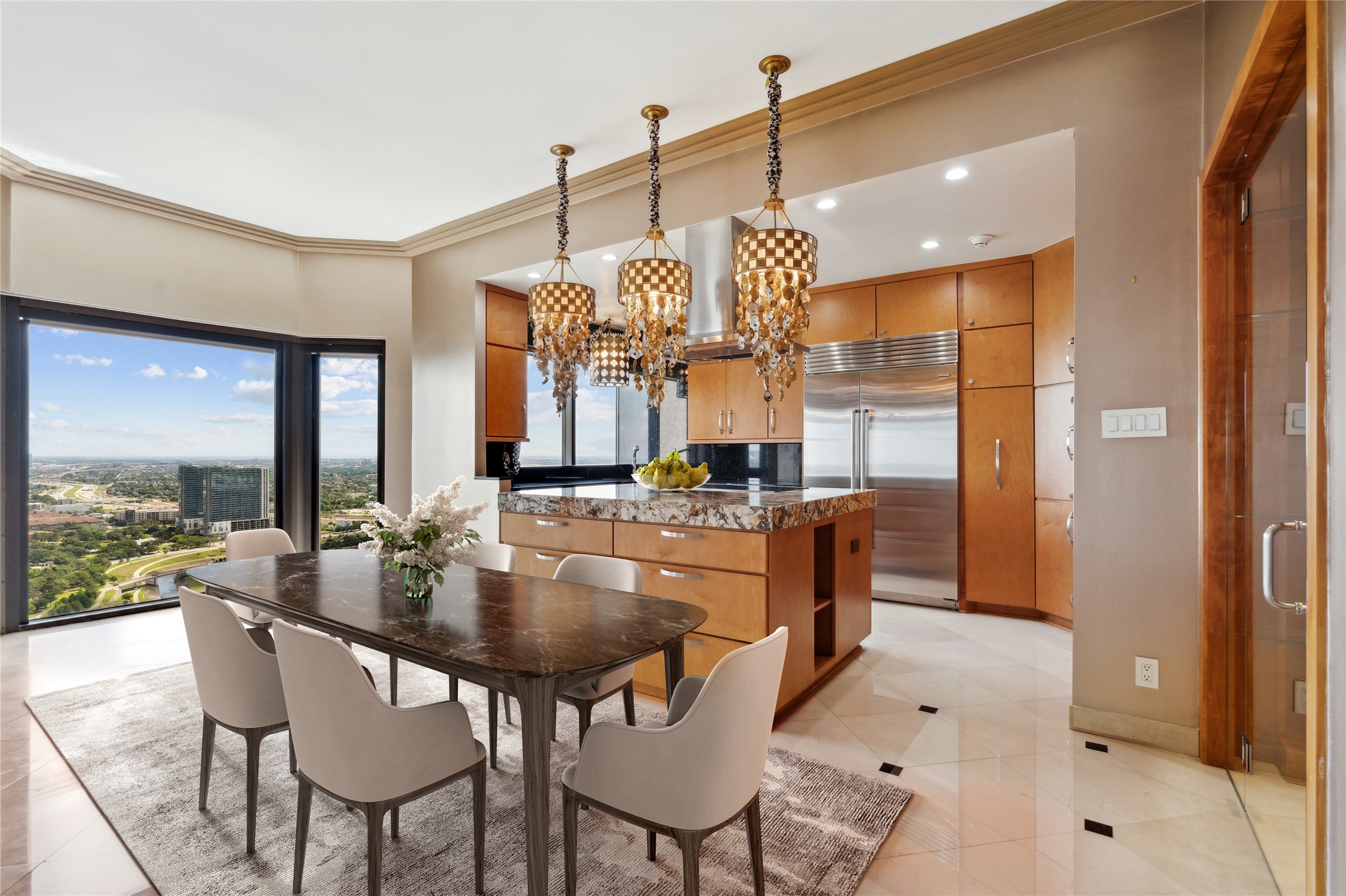 2001 Holcombe Boulevard, Unit PH4 Houston, TX 77030 - Photo 2 of 46 a dining table chairs and a chandelier