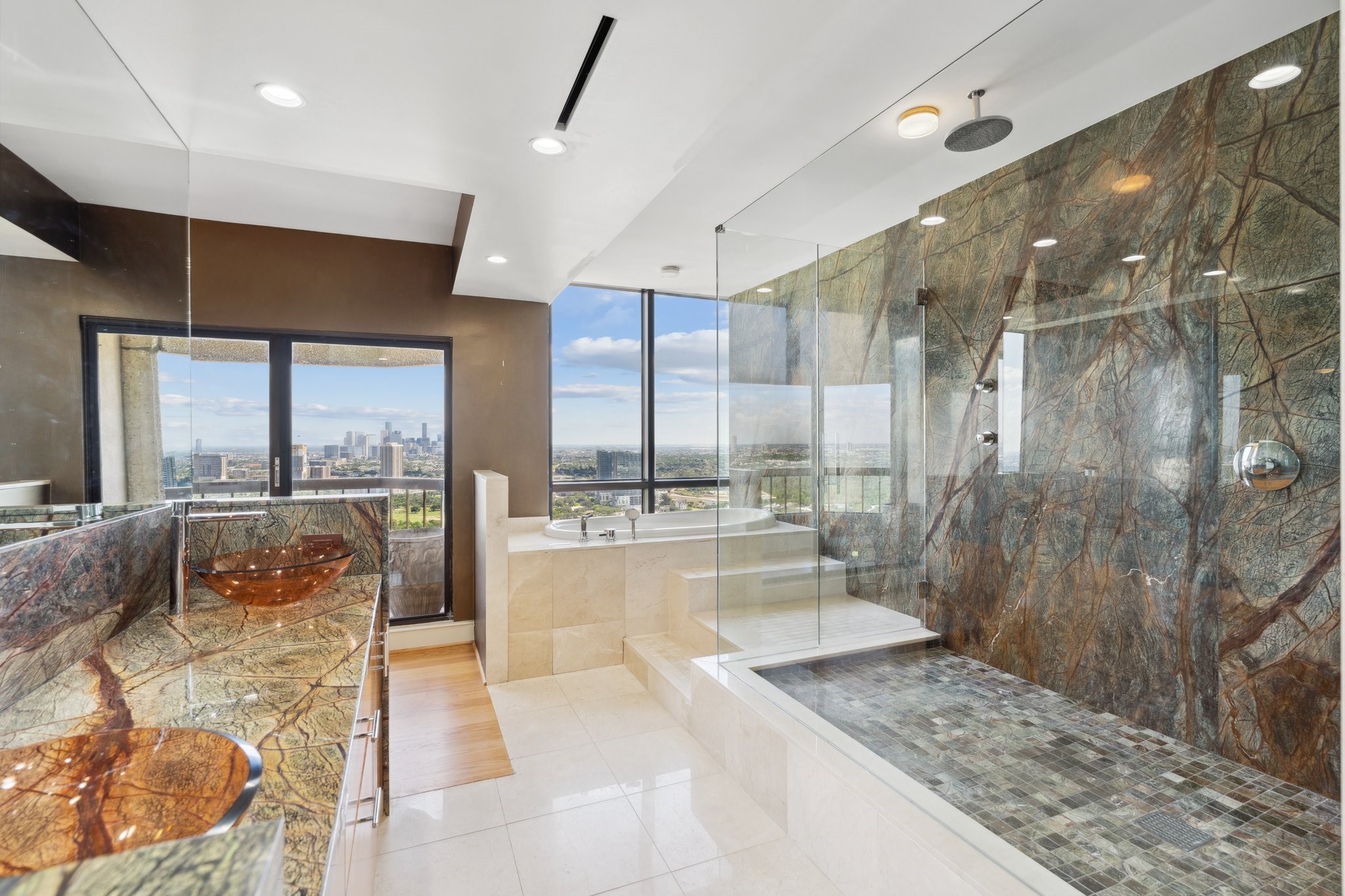 2001 Holcombe Boulevard, Unit PH4 Houston, TX 77030 - Photo 7 of 46 a large bathroom with a large tub and shower