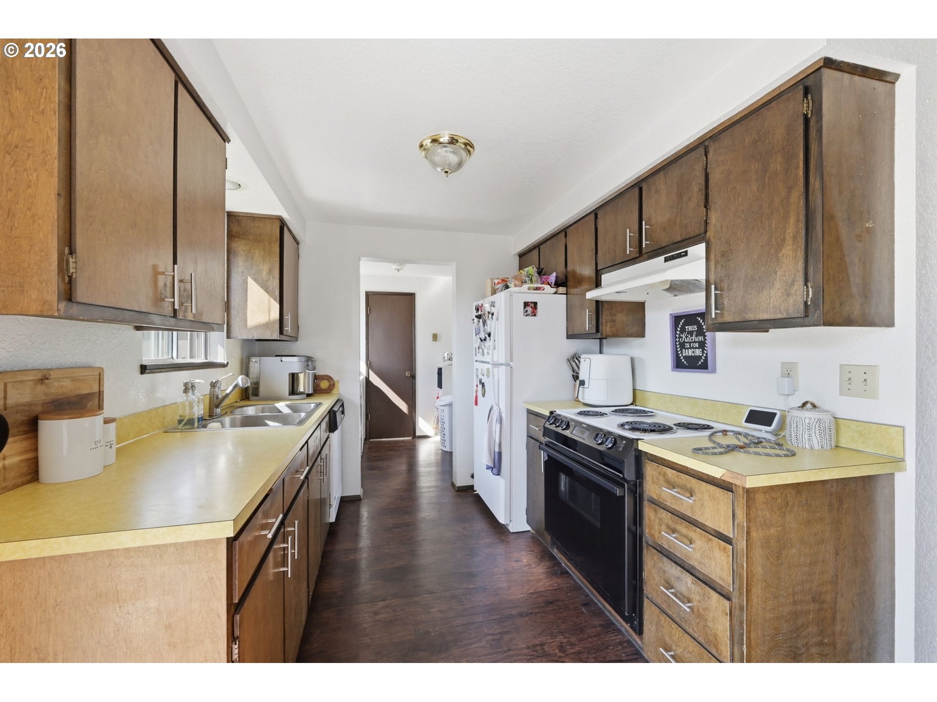 2018 Debra Drive Springfield, OR 97477 - Photo 11 of 42 a kitchen with stainless steel appliances granite countertop a sink stove and refrigerator