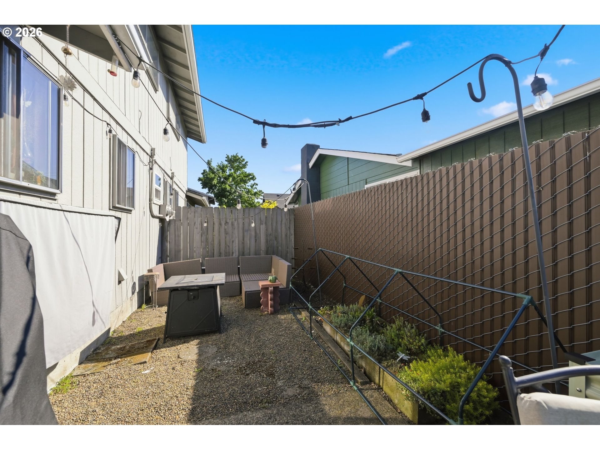 2018 Debra Drive Springfield, OR 97477 - Photo 21 of 42 a backyard of a house with chairs and wooden fence