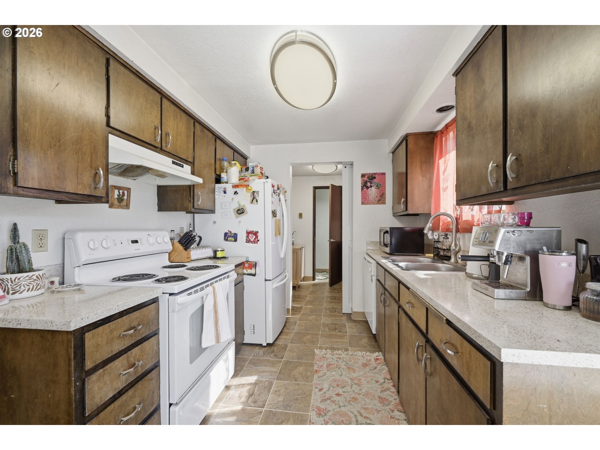 2018 Debra Drive Springfield, OR 97477 - Photo 31 of 42 a kitchen with a sink stove and cabinets