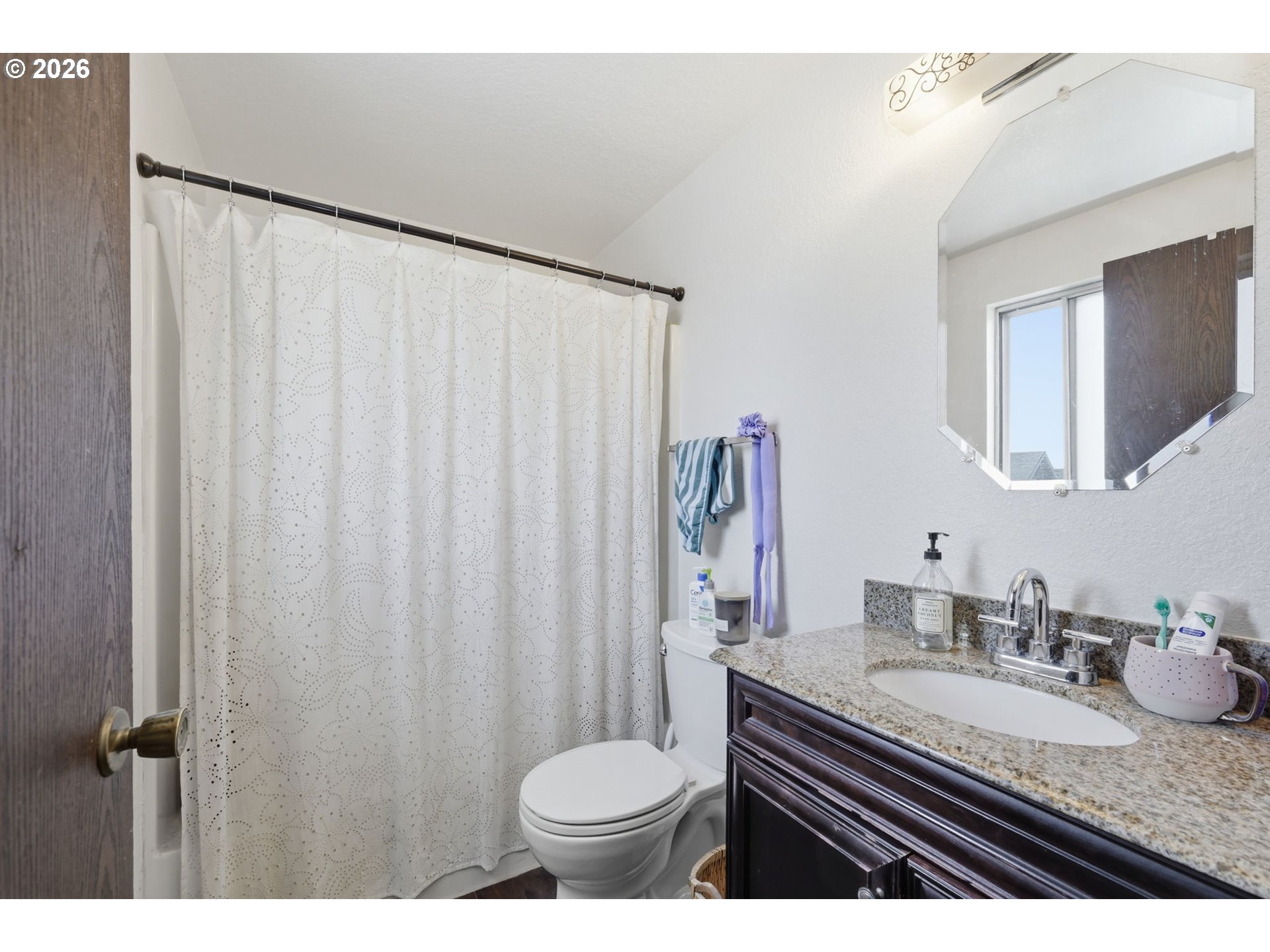 2018 Debra Drive Springfield, OR 97477 - Photo 38 of 42 a bathroom with a granite countertop sink and a mirror