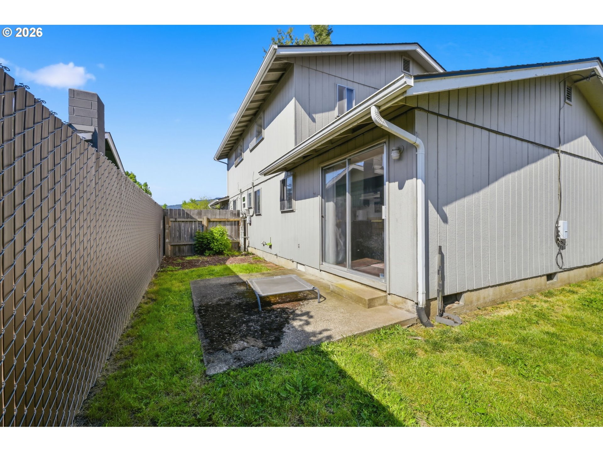 2018 Debra Drive Springfield, OR 97477 - Photo 40 of 42 a view of a small house with a small yard and wooden fence
