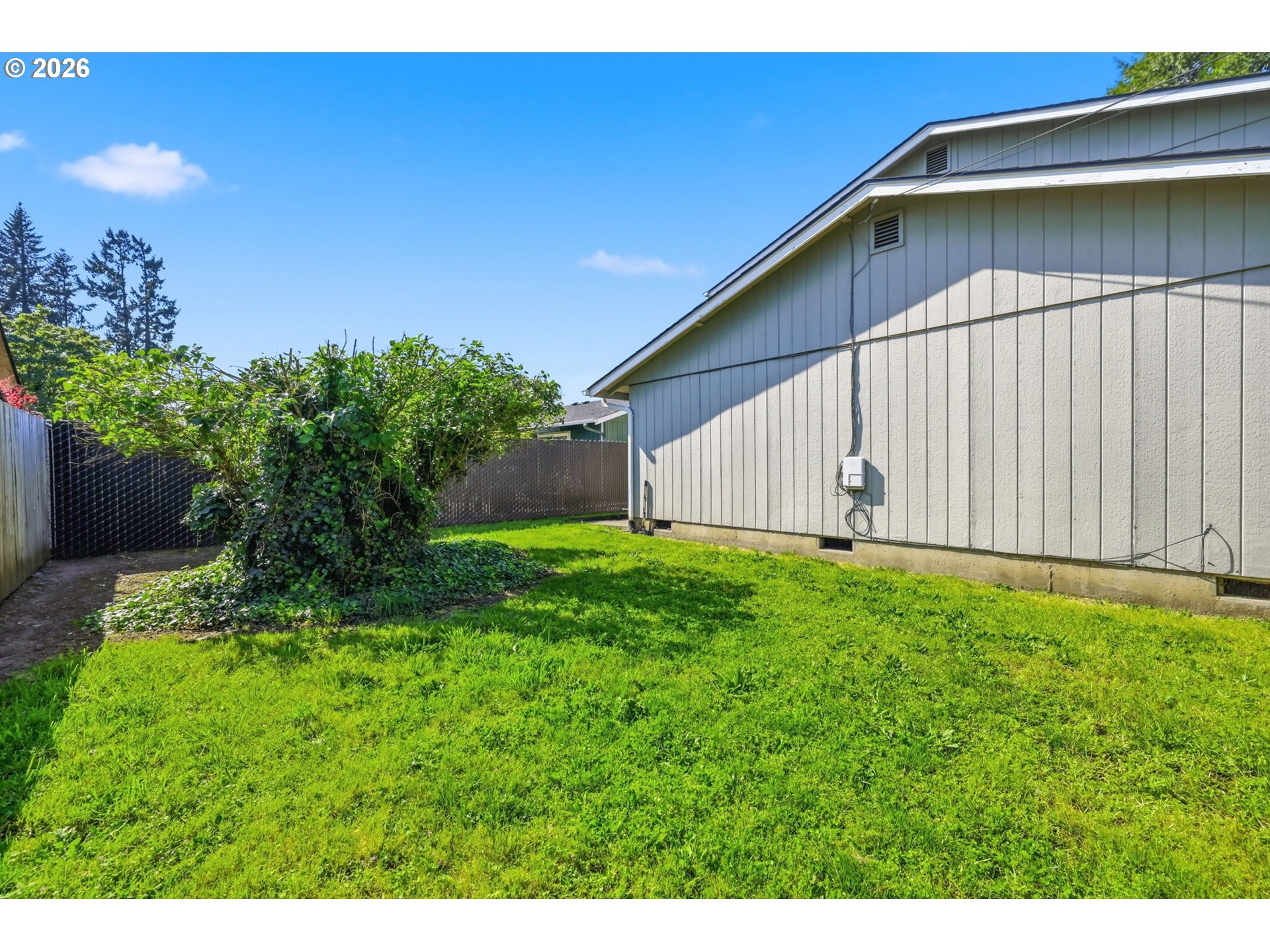 2018 Debra Drive Springfield, OR 97477 - Photo 41 of 42 a backyard of a house with lots of green space