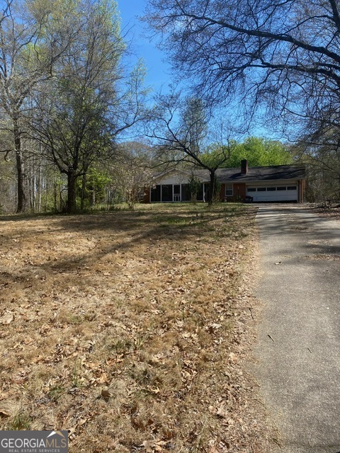 964 Ridgeway Church Road Commerce, GA 30529 - Photo 1 of 1 a view of a backyard with large trees