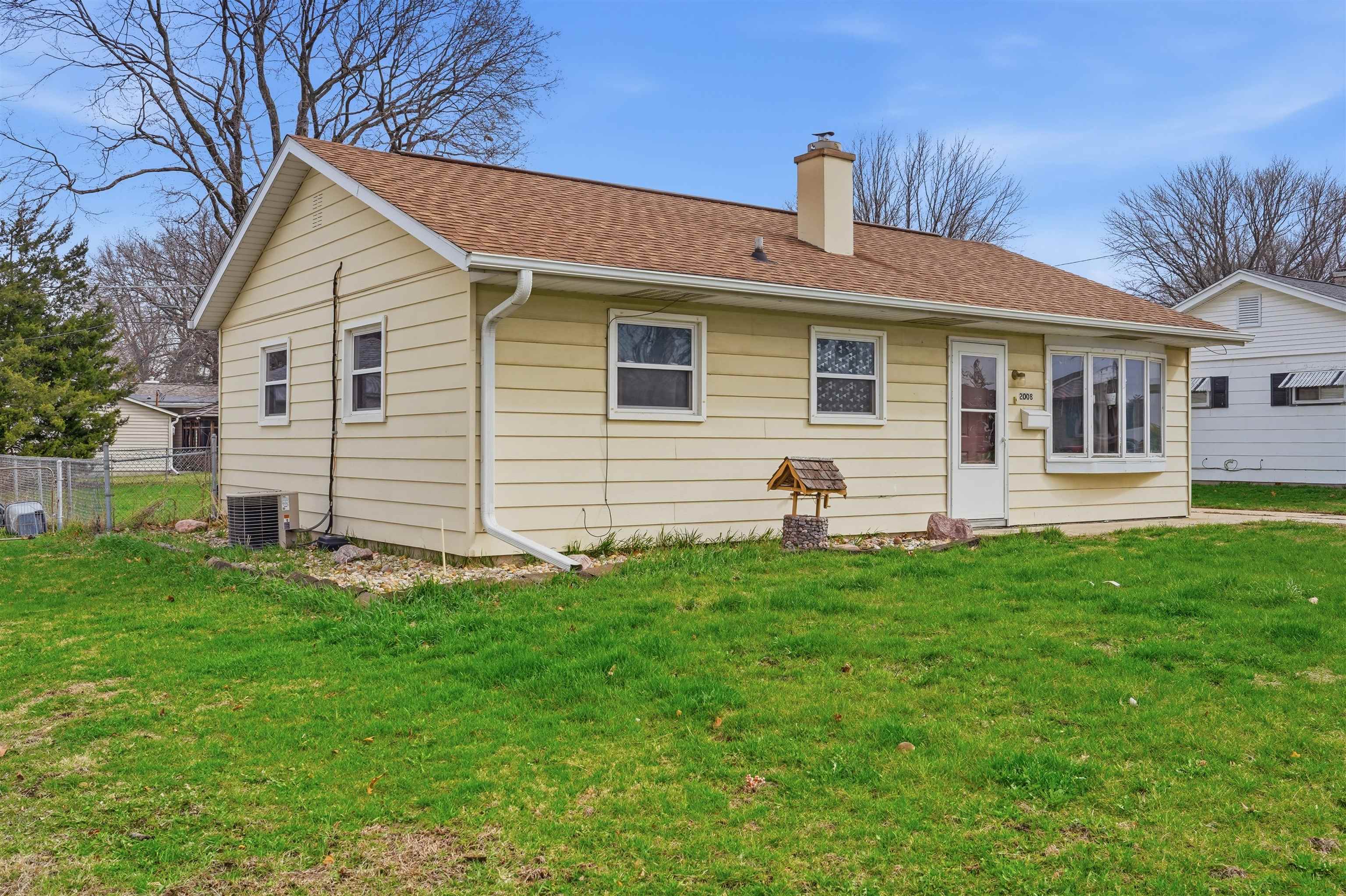 2008 East 6th Street Sterling, IL 61081 - Photo 13 of 16 a front view of a house with a yard