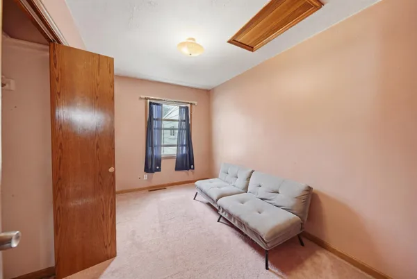 a living room with furniture and window