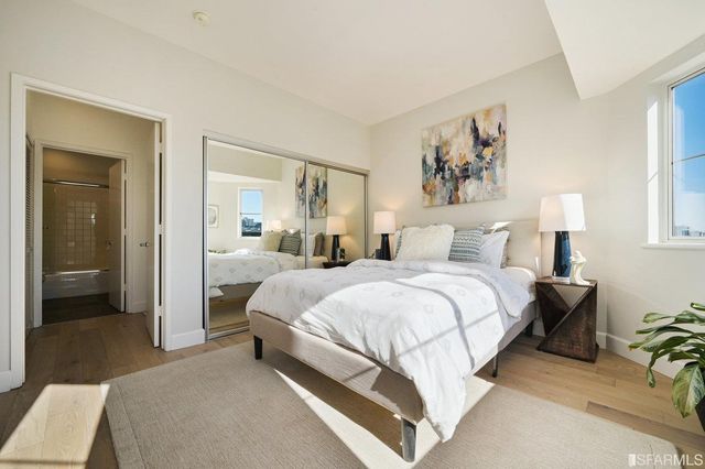 a bedroom with a bed and a couch