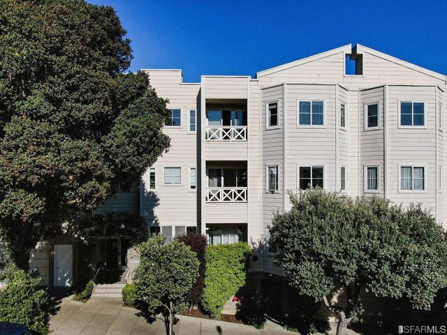 a couple of potted plants in front of door