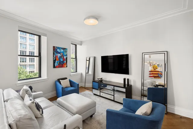 a open kitchen with stainless steel appliances kitchen island granite countertop a stove a sink dishwasher a dining table and chairs with wooden floor