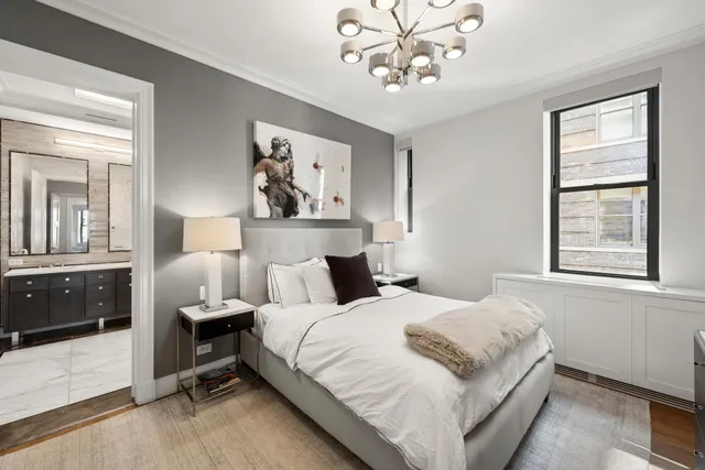 a bathroom with a sink a mirror and a window