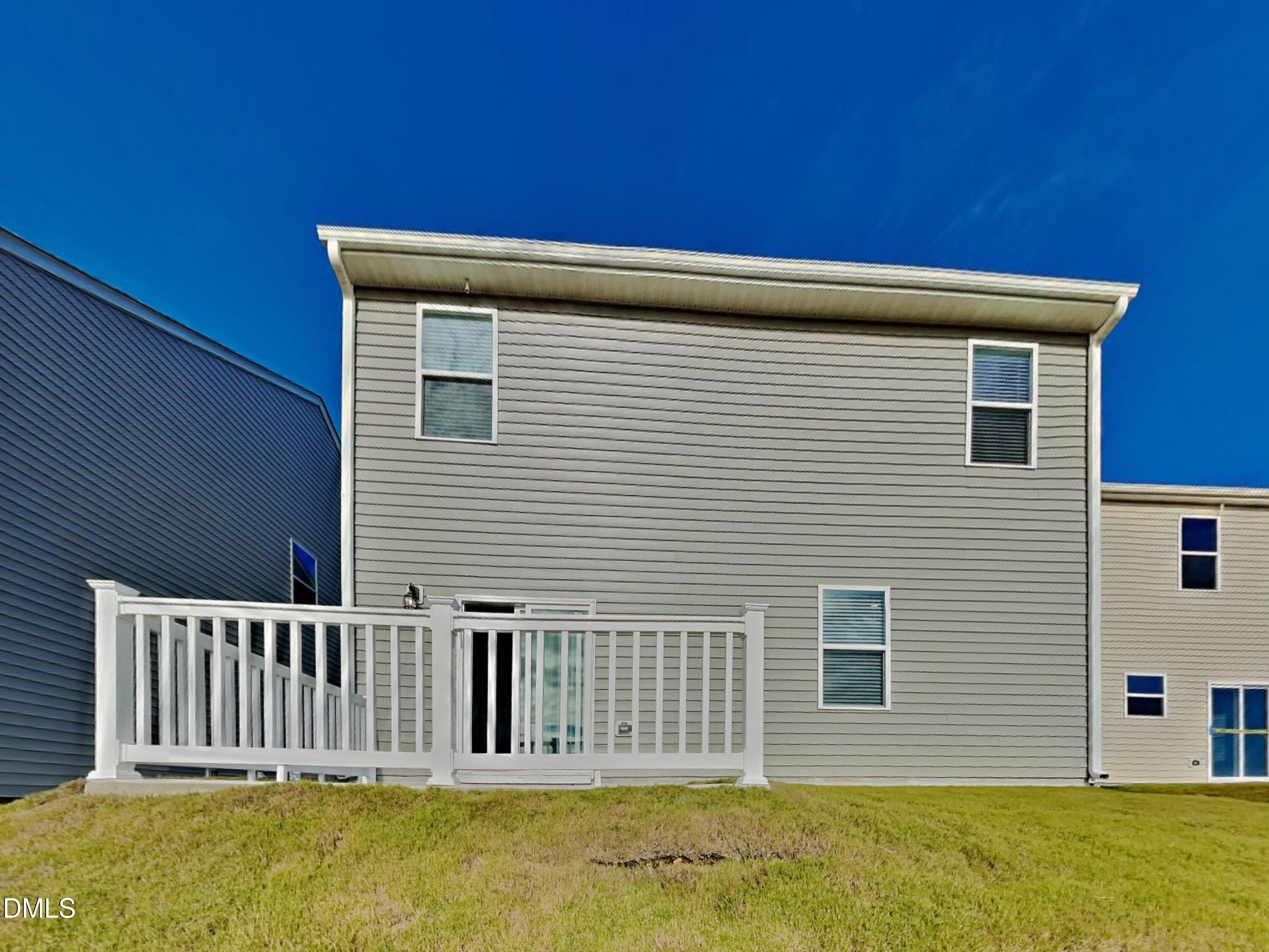 141 Chapel Drive Fuquay-Varina, NC 27526 - Photo 18 of 18 a view of a house with a backyard