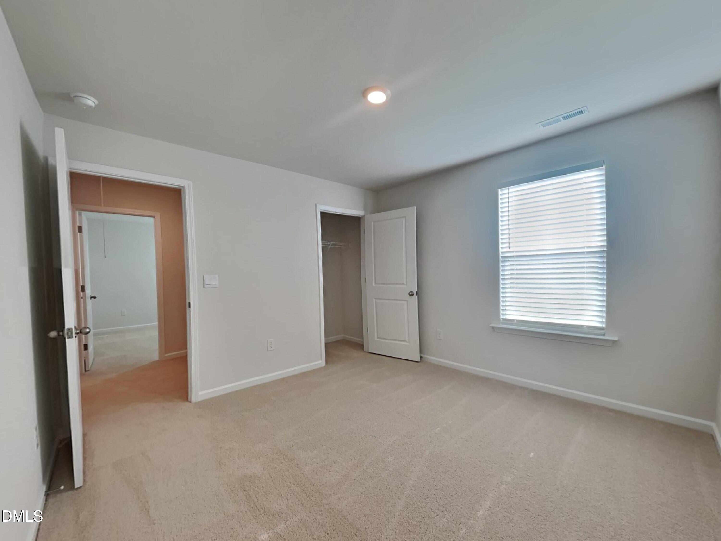 141 Chapel Drive Fuquay-Varina, NC 27526 - Photo 10 of 18 a view of an empty room with a window