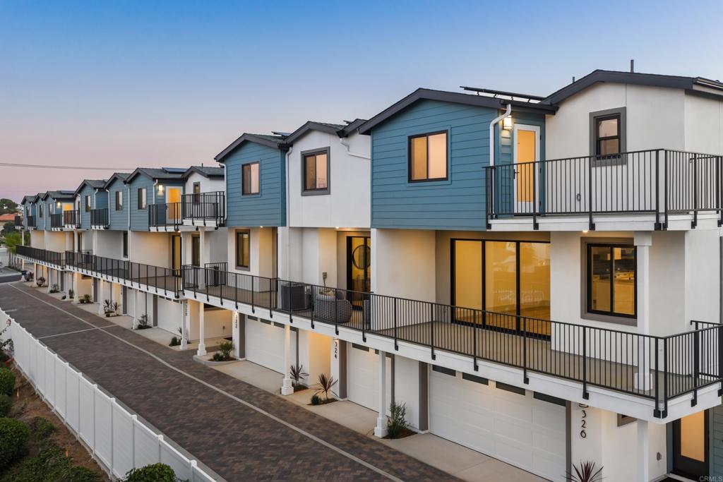 a front view of a house with large windows