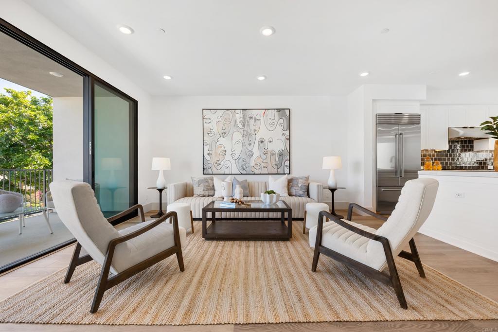 310-326 Chinquapin Avenue Carlsbad, CA 92008 - Photo 11 of 33 a living room with furniture and a large window