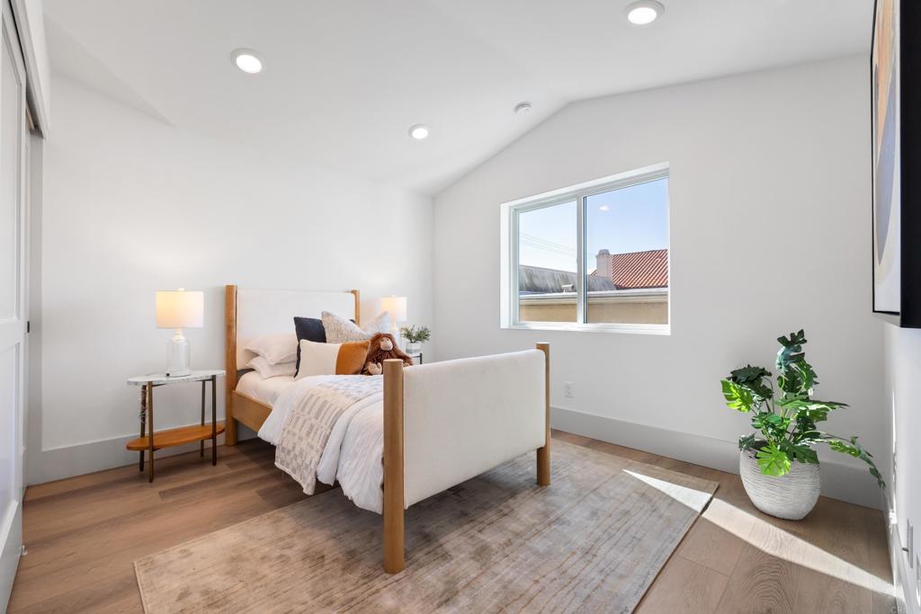 310-326 Chinquapin Avenue Carlsbad, CA 92008 - Photo 25 of 33 a bed room with a bed and a window