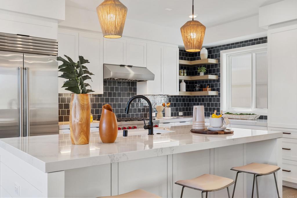 310-326 Chinquapin Avenue Carlsbad, CA 92008 - Photo 8 of 33 a kitchen with a sink and a cabinets