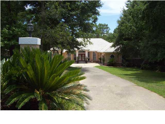 254 Ridge Lake Road Crestview, FL 32536 - Photo 1 of 29 a view of a backyard with a garden