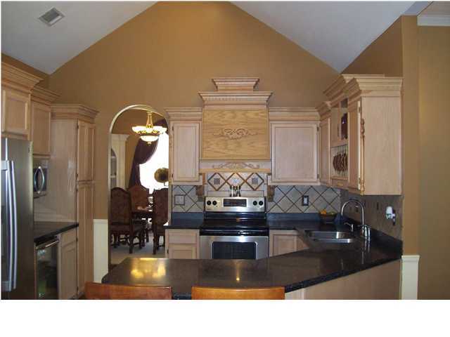 254 Ridge Lake Road Crestview, FL 32536 - Photo 2 of 29 a bathroom with a sink a large mirror and shower