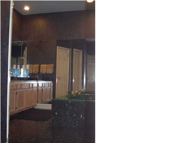254 Ridge Lake Road Crestview, FL 32536 - Photo 16 of 29 a picture of a bathroom with a sink and a mirror