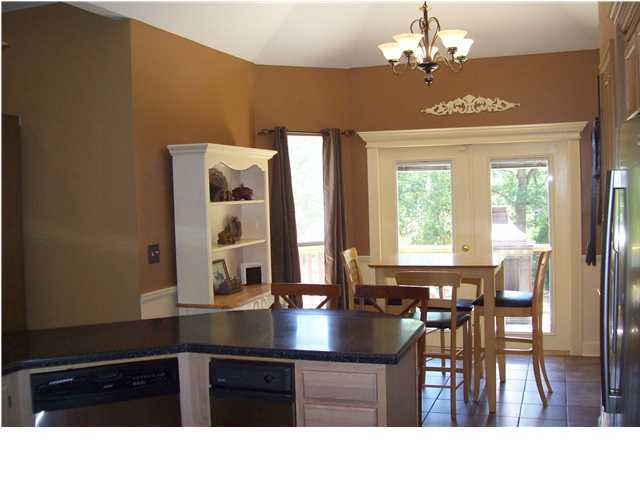 254 Ridge Lake Road Crestview, FL 32536 - Photo 18 of 29 a kitchen with a table chairs and chandelier