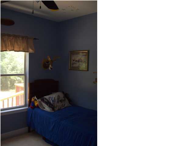 254 Ridge Lake Road Crestview, FL 32536 - Photo 22 of 29 a living room with furniture and a window